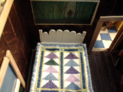 This is my Granny's bedroom. That's my brother's artwork (in miniature) on the wall.